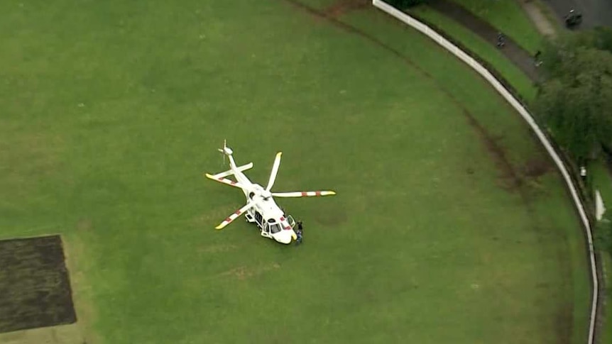 A helicopter on a large oval, seen from above