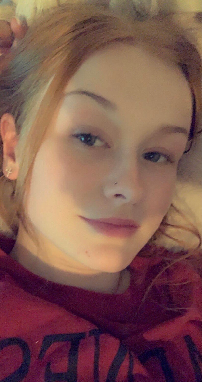 Jodi Willard laying down inside her home.