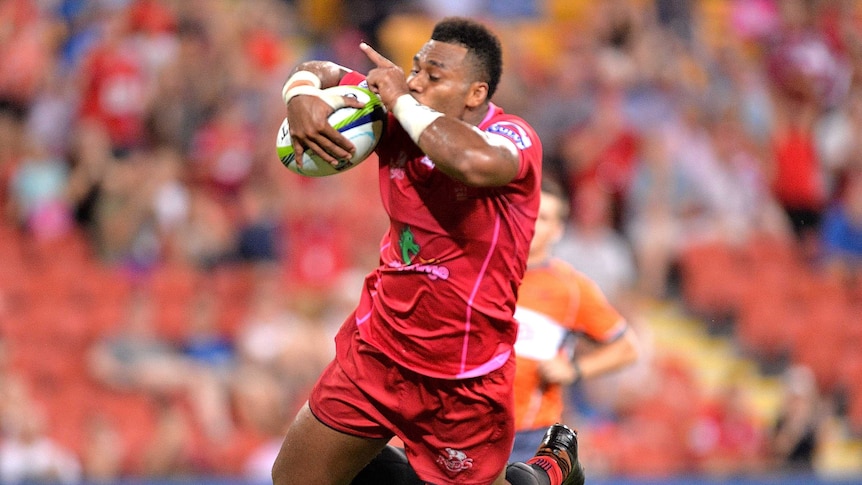 Samu Kerevi of the Reds scores a try