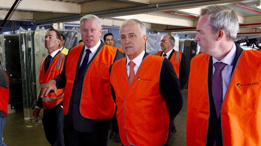 Malcolm Turnbull wears hi-vis vest at mattress factory 1
