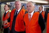 Malcolm Turnbull wears hi-vis vest at mattress factory 1