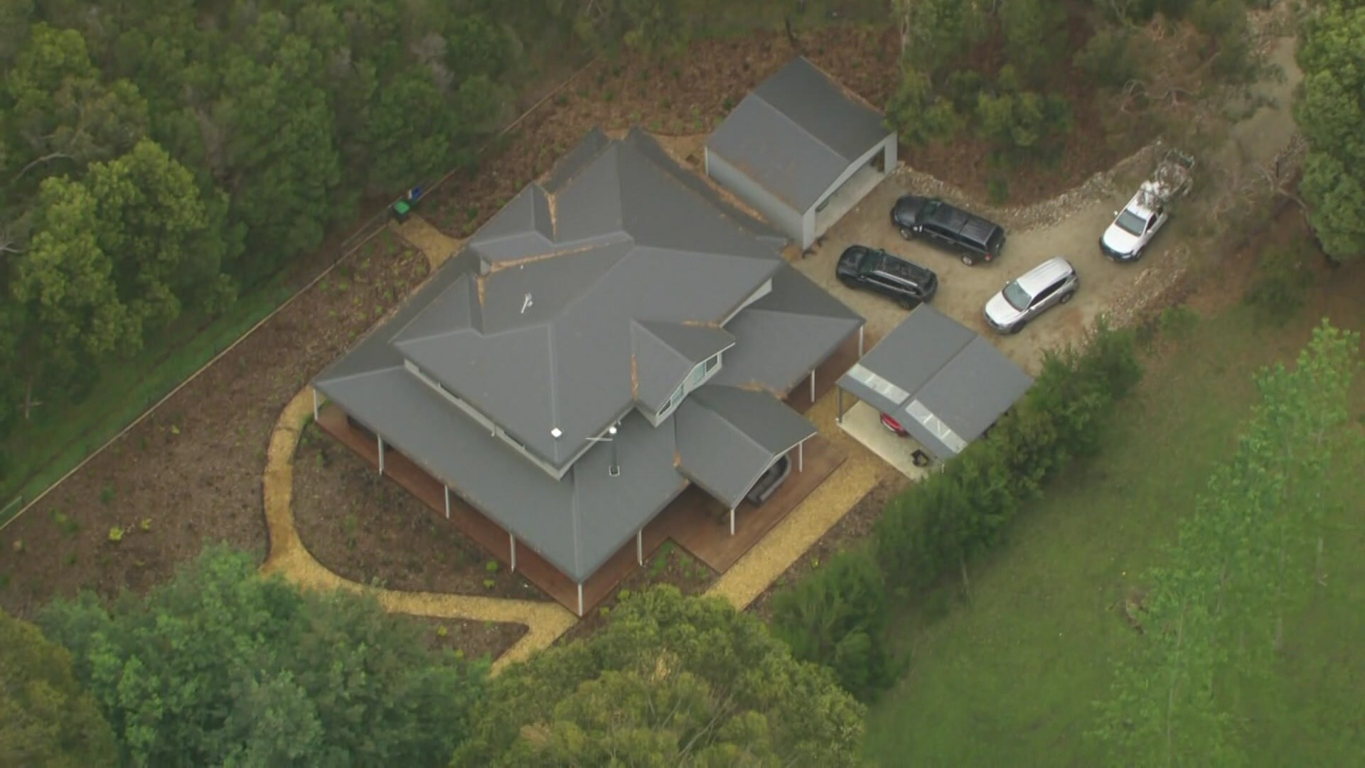 An aeriel image of Erin Patterson's home in Leongatha with four vehicles parked in the drive way