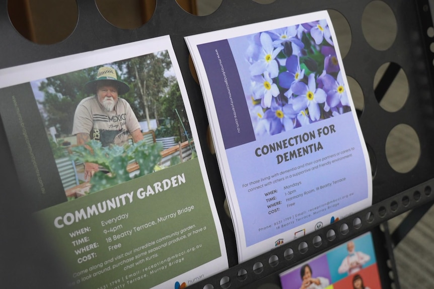 Papers advertising a community garden program and another program for people living with dementia. 