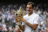 Roger Federer celebrates with the Wimbledon trophy after beating Marin Cilic in the final.
