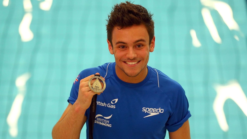 Britain's Tom Daley poses with his gold medal after the 10m final of the FINA Diving World Series.