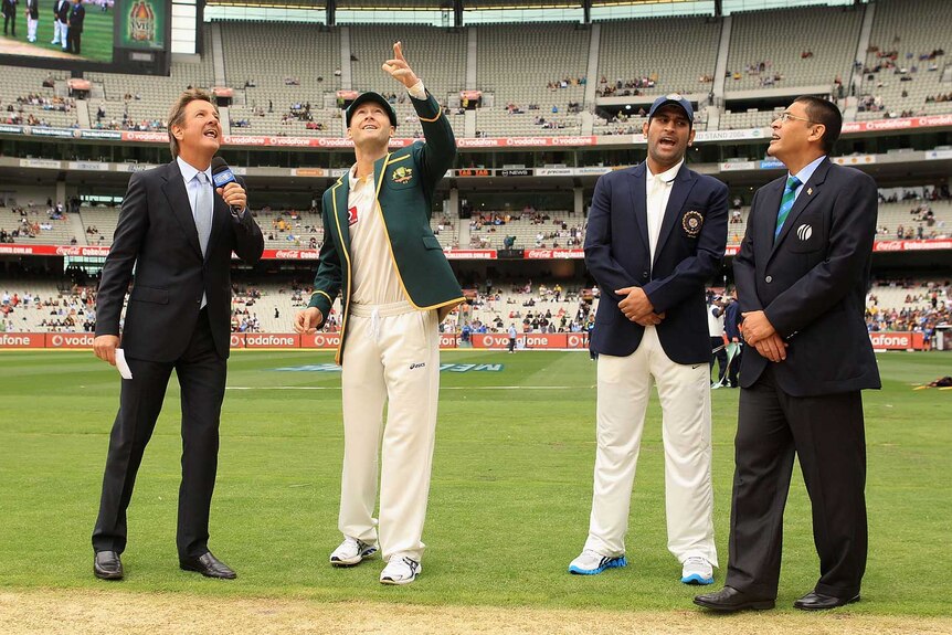 Clarke tosses the coin at the MCG