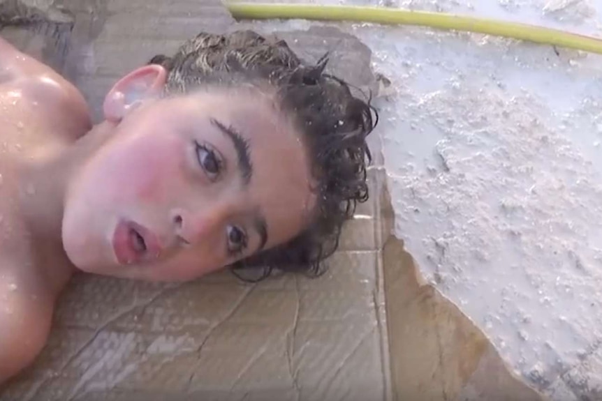 A Syrian boy who died in a chemical attack