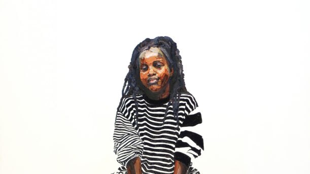 Portrait of Tkay Maidza dressed in stripes and check pattern, seated