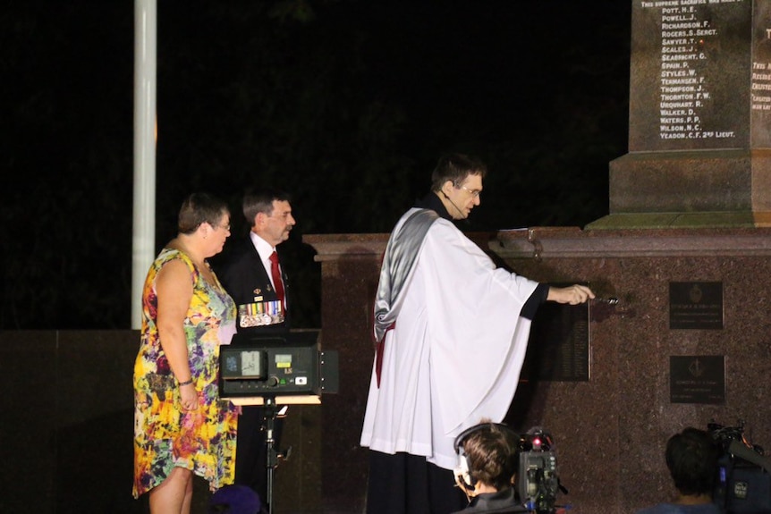Ray and Pam Palmer lay the first wreath during Darwin's Dawn Service
