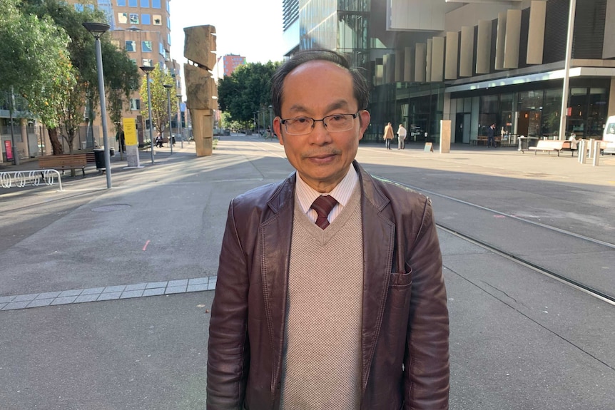 An image of a man outside a streetscape in Sydney