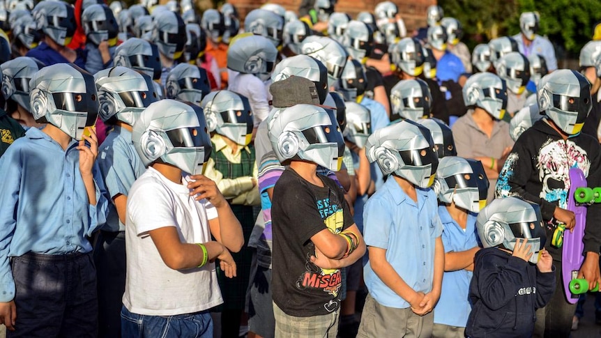 Wee Waa residents don Daft Punk helmets ahead of the global launch of the band's new album.