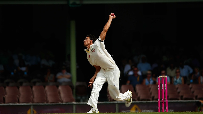 Mitchell Starc bowling.