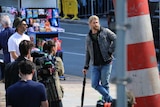 Chris Hemsworth leans on an umbrella on the set of Thor in Brisbane.