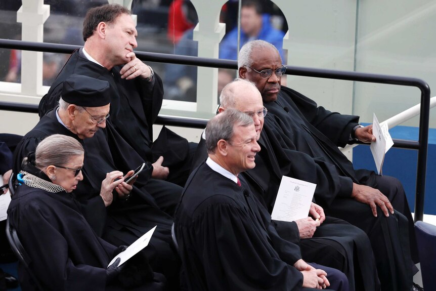 Supreme Court justices sit together at the inauguration ceremony