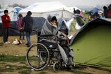Refugee in a wheelchair