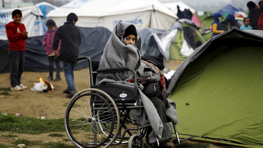 Refugee in a wheelchair
