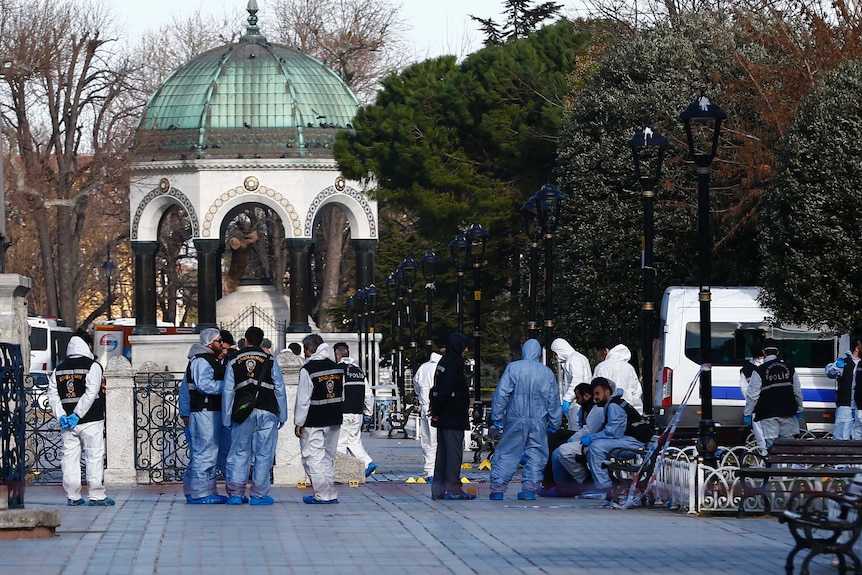Police forensic officers attend scene after an explosion in Sultanahmet Square in Istanbul