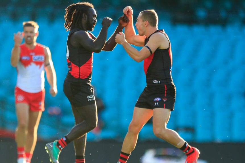 Anthony McDonald-Tipungwuti and Devon Smith bump fists in celebration
