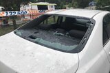 A car window smashed by hail