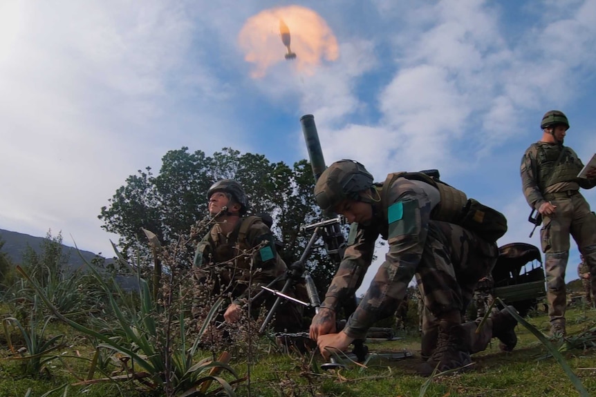 Legionnaires fire a mortar round during a training exercise on Corsica.