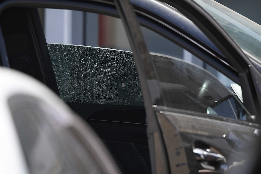 Bullet hole in passenger window