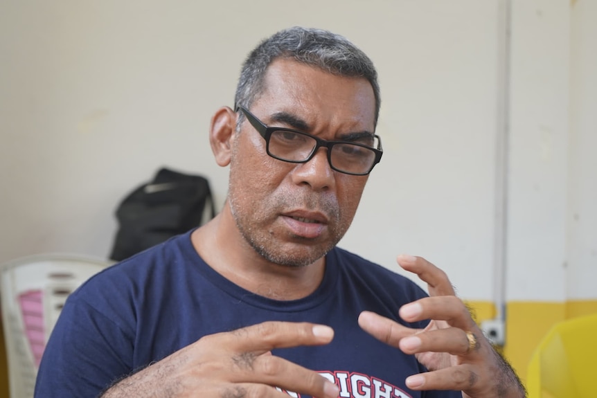 A Timorese man with glasses
