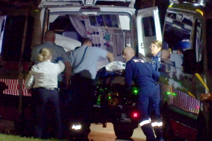 Paramedics try to resuscitate a man who was stabbed multiple times.