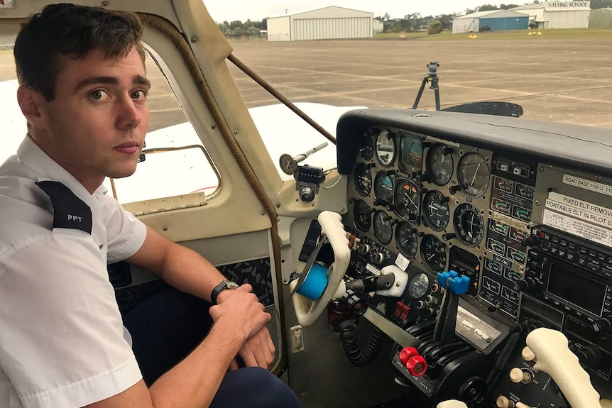 Zac Cox at the controls of a light plane.