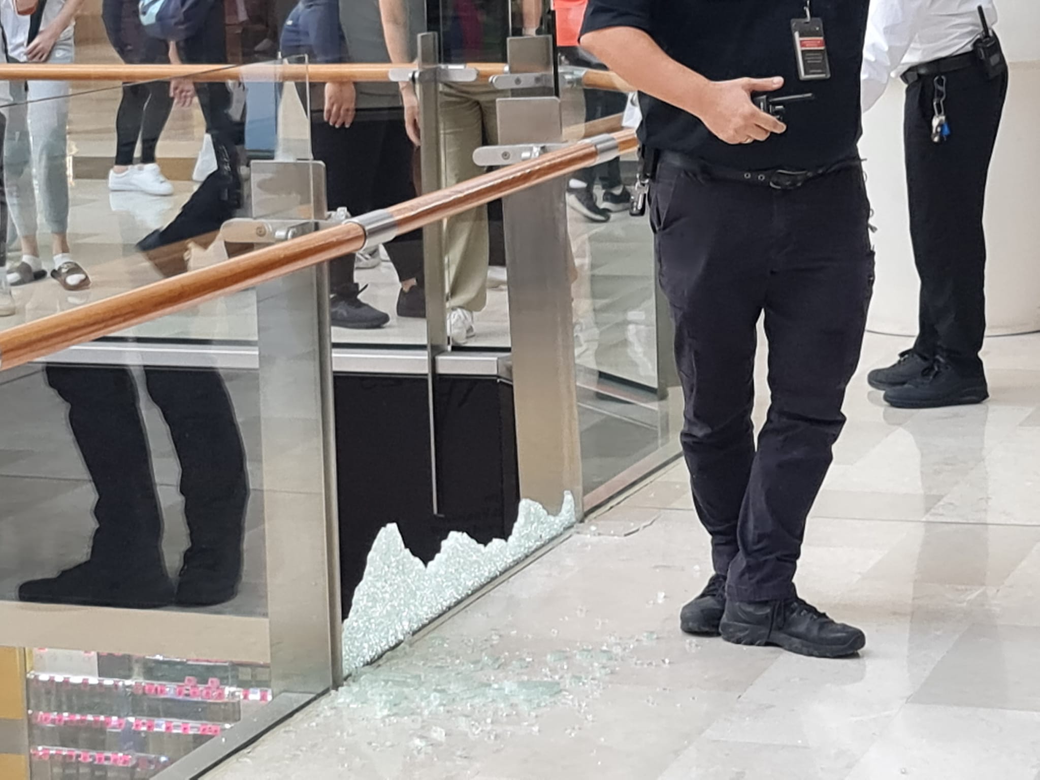 Shattered glass at Westfield Liverpool after a car accelerated forward
