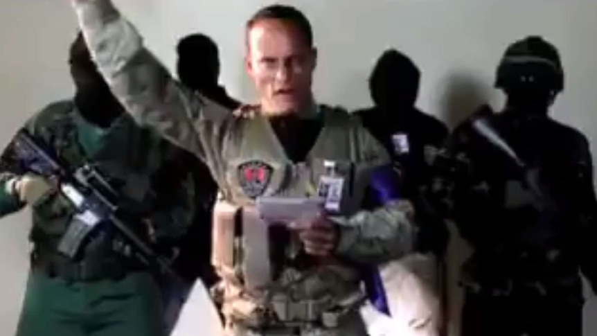 Venezuelan police squad pilot Oscar Perez appears in social media video raising his hand with four masked people behind him