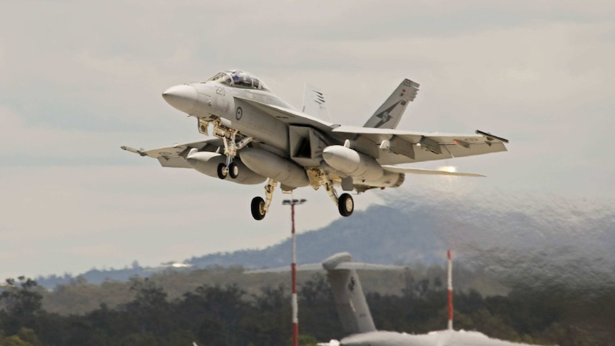 An F/A-18F Super Hornet departs an RAAF base for operations in the Middle East.