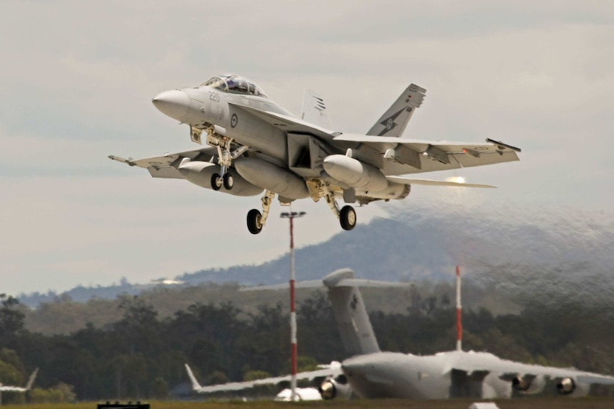 An F/A-18F Super Hornet departs an RAAF base for operations in the Middle East.