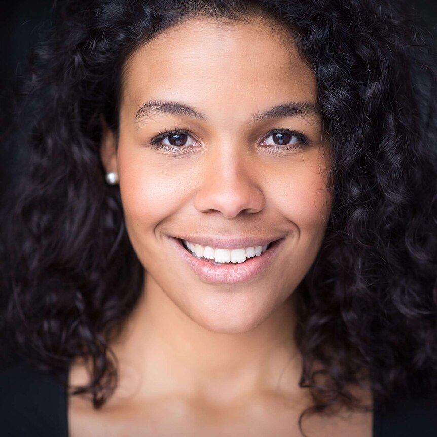 Close-up, smiling portrait of actor Zahra Newman.