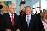 Andrew Forrest and Malcolm Turnbull walk past cameras at a press gathering in Canberra