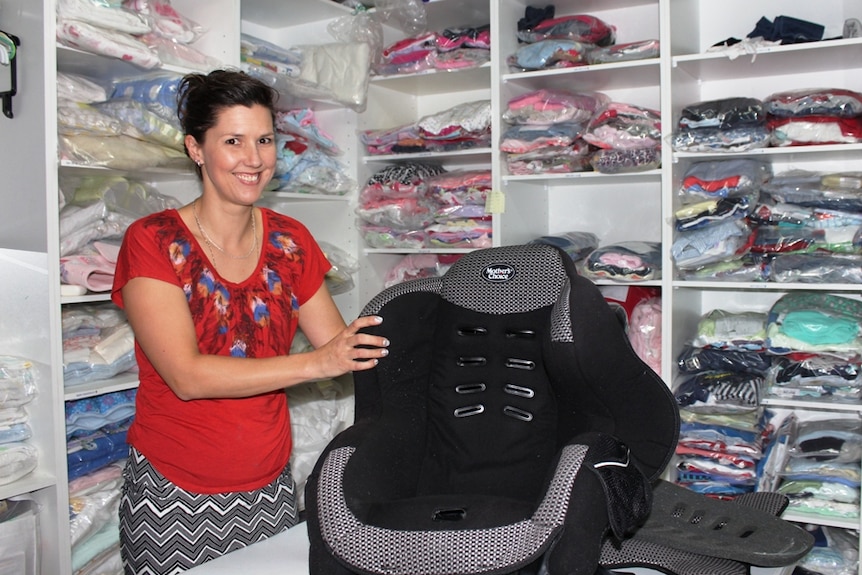 Olivia's Place founder Kirsten Finger with a car seat ready to be rehoused.