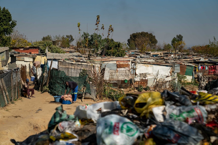 A scene of harrowing mob "justice". Suspected rapists were burnt near these homes in Diepsloot.