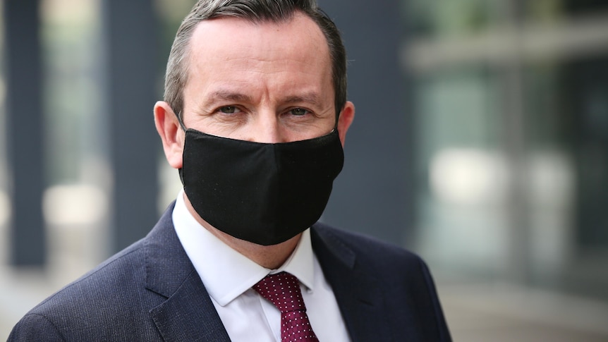 Premier Mark McGowan wearing a black face mask.