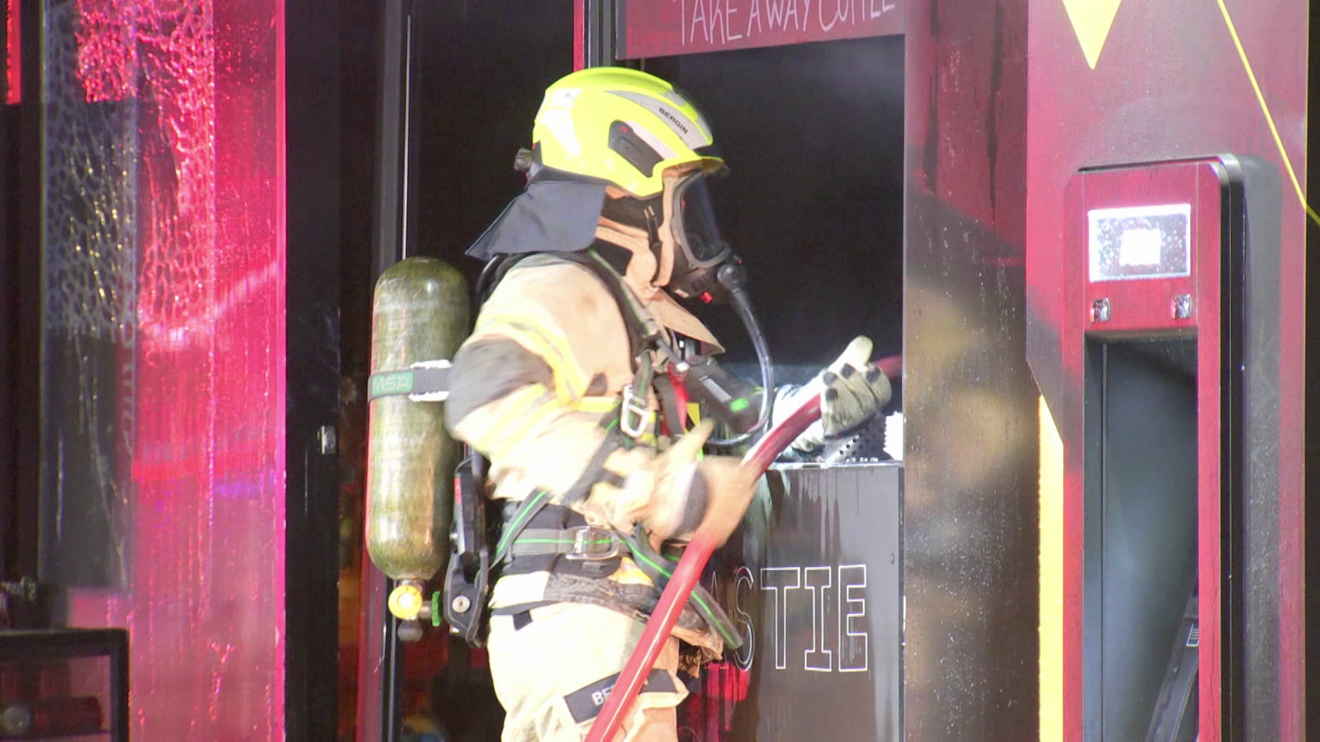 A firefighter at a cafe