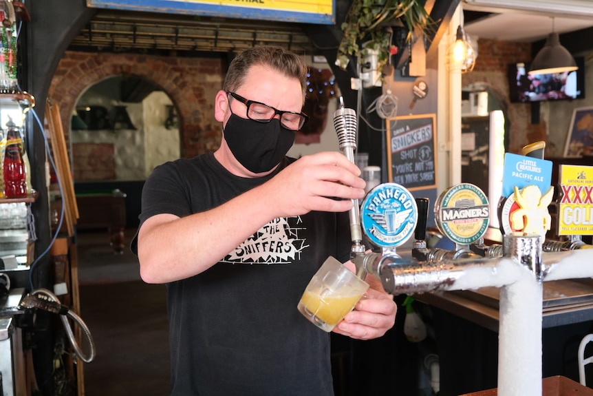 Stuart Gaunt pours a beer