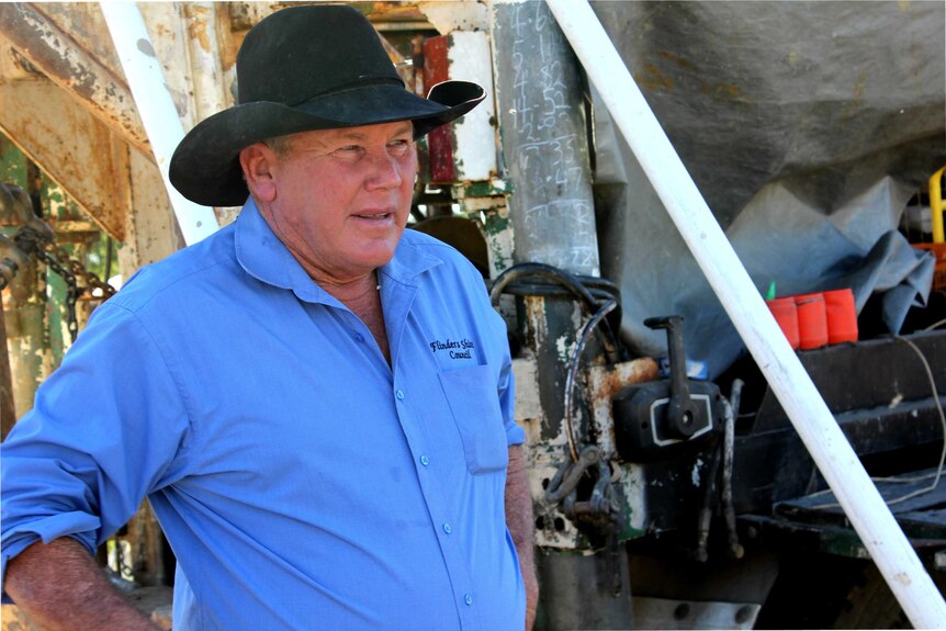 Clancy Middleton from the Flinders Shire Council stands in front of a potential bore, at their cropping project.