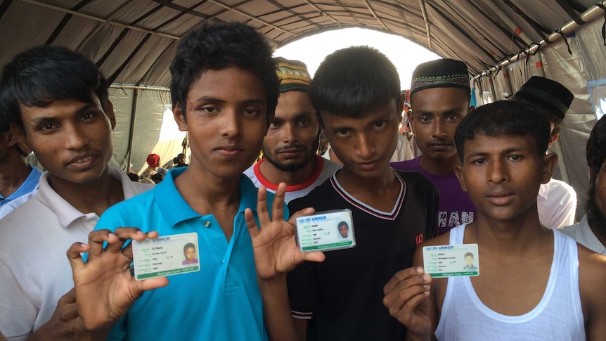 Rohingyas at Langsa, Aceh, showing their UNHCR refugee cards