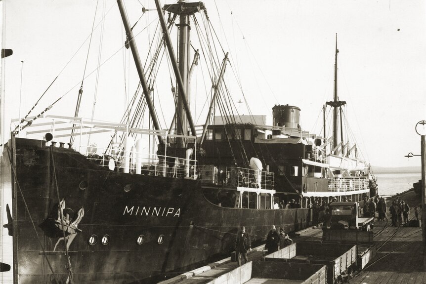 A black and white photo of a ship berthed at Port Lincoln.