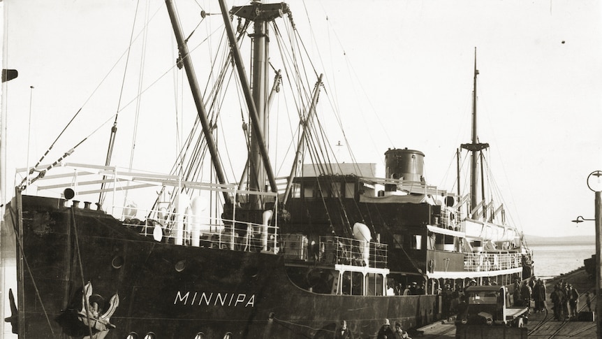 A black and white photo of a ship berthed at Port Lincoln.