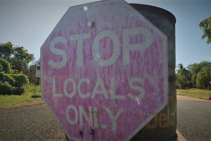 Sign on a barrel at Ardyaloon that reads "STOP. LOCALS ONLY" 