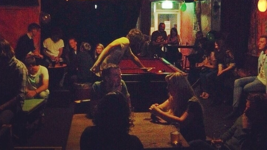 People drinking in the original Phoenix bar venue in Canberra.