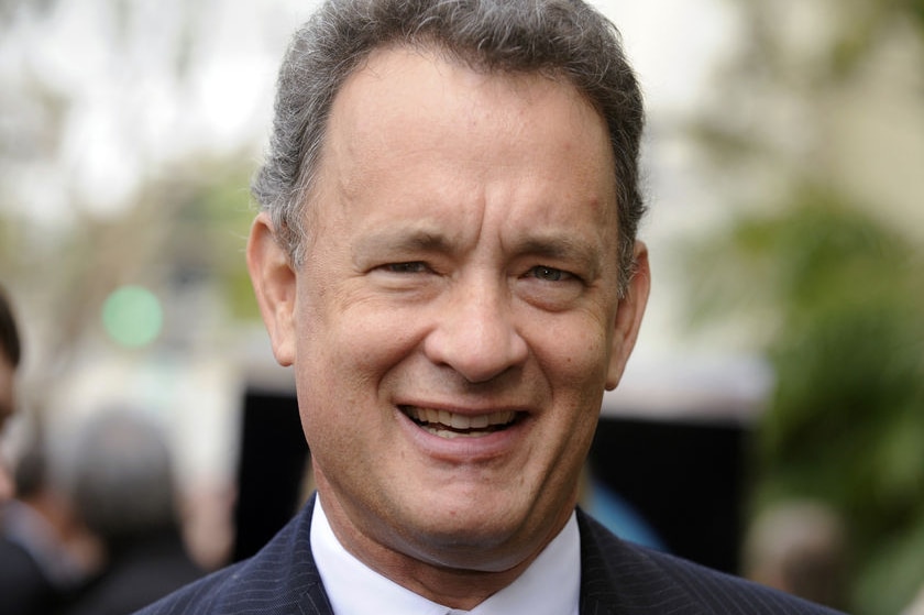 A close photo of Tom Hanks's smiling face.