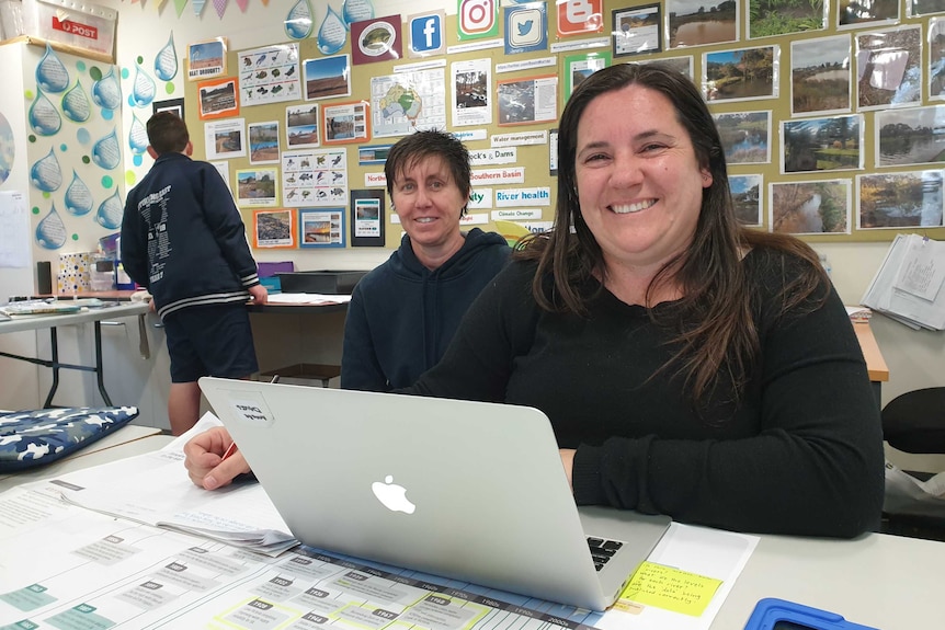 Two teachers in a classroom.