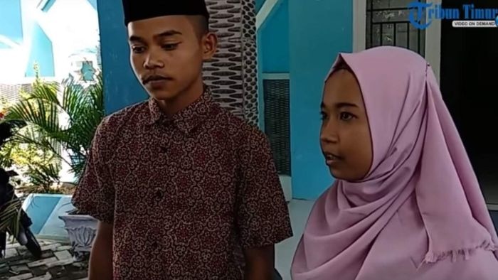 A screengrab of an Indonesian news story shows a young couple.