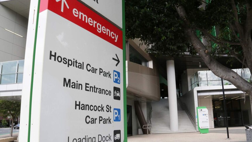 Main entrance and emergency sign outside a building of the Queensland Children's Hospital in Brisbane.