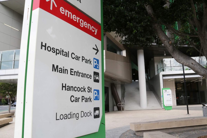 Main entrance and emergency sign outside a building of the Queensland Children's Hospital in Brisbane.